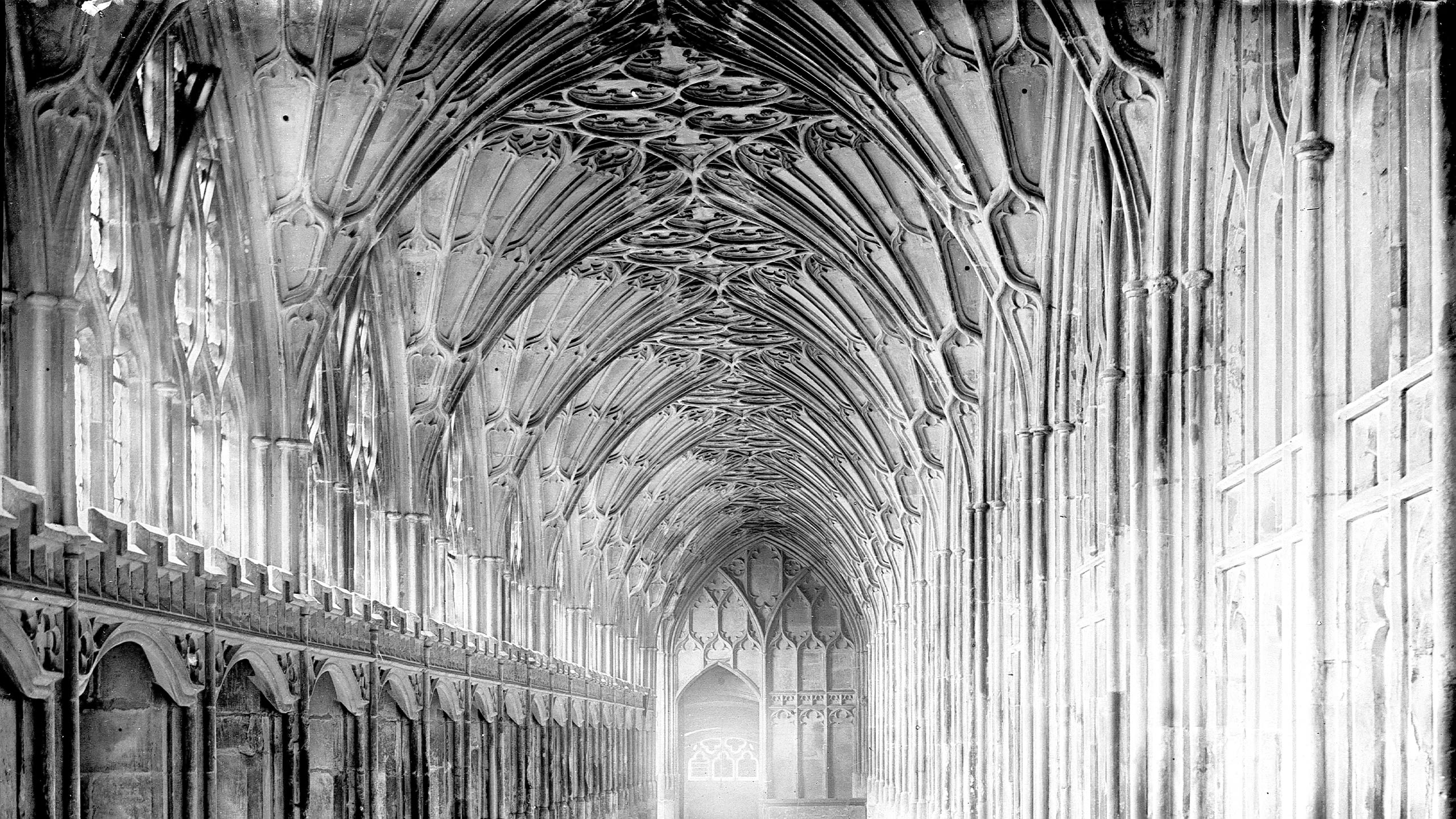 Intricately carved gothic cloister ceiling with ribbed vaults and large arched windows from Gloucester Cathedral. MS 5180